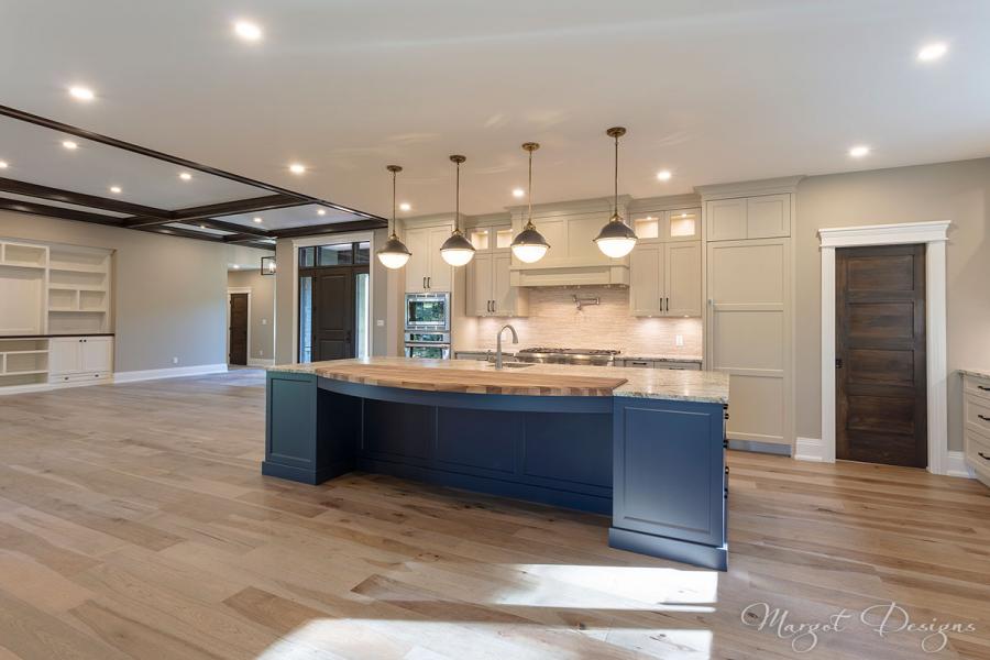 Wide view of custom kitchen with hardwood floors